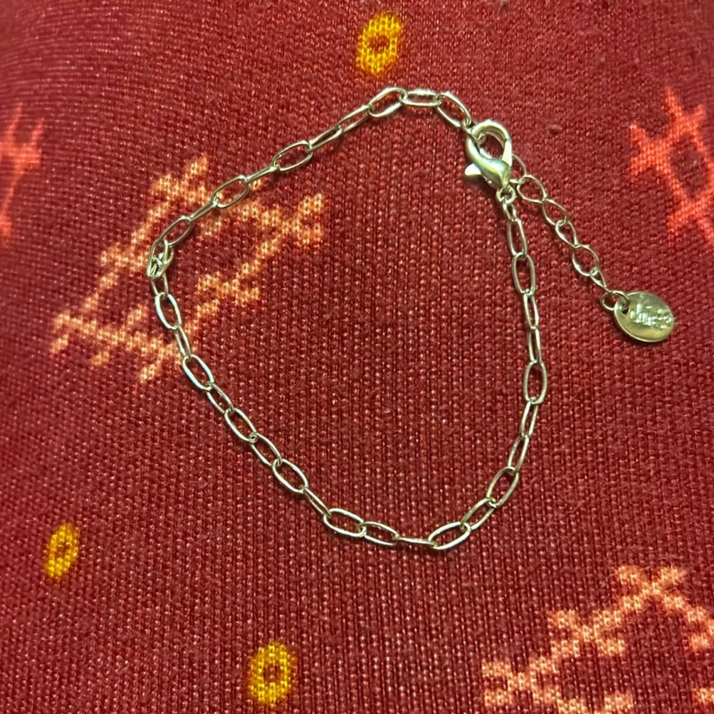This is a silver Claire’s bracelet.
